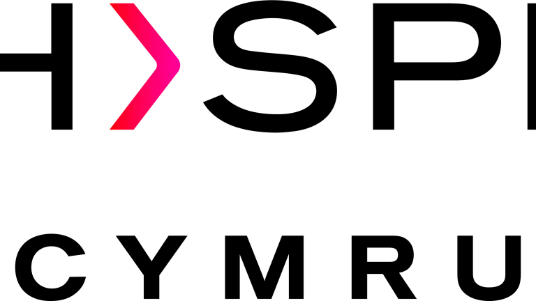 Whisper Cymru logo with bold black text and a pink greater-than symbol replacing the letter "I" in "Whisper"