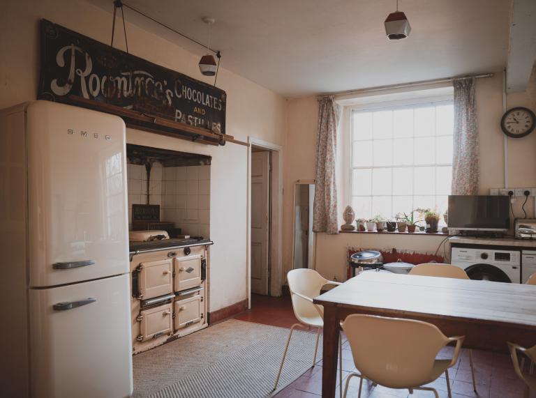 rustic white furniture that fills the farmhouse kitchen