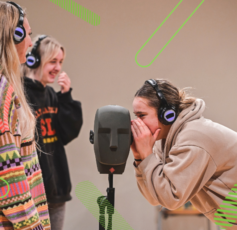 three young women practicing theatre skills