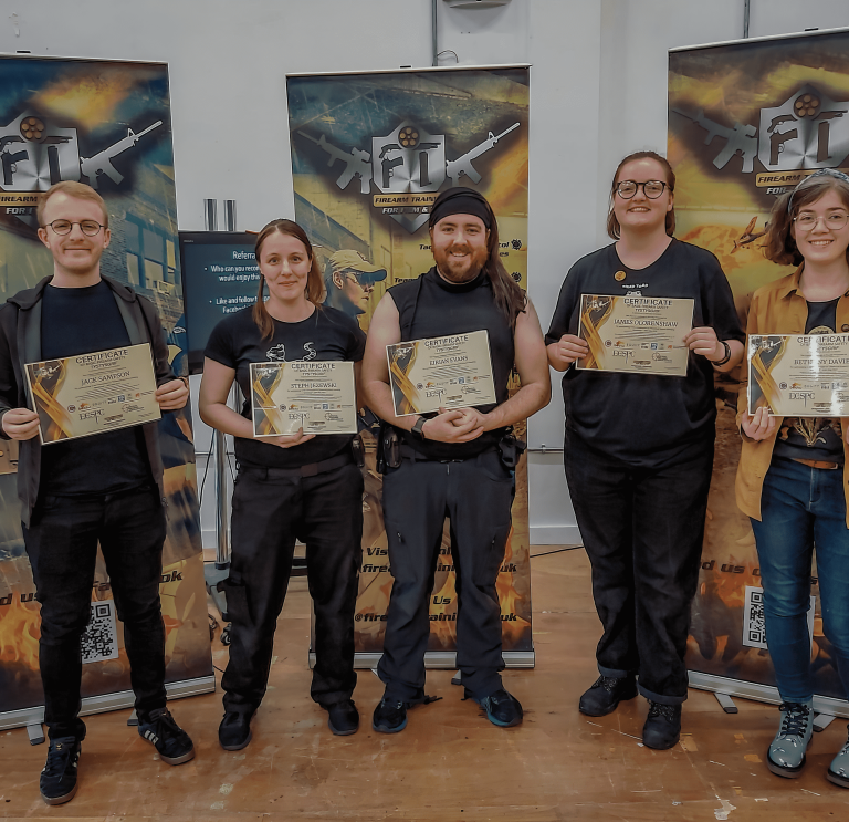 Five young people showing their training certificates to the camera