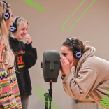 three young women practicing theatre skills