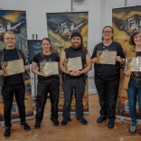 Five young people showing their training certificates to the camera
