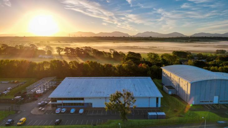 Aria Film Studios from above with the Snowdonia mountain range in the distance.