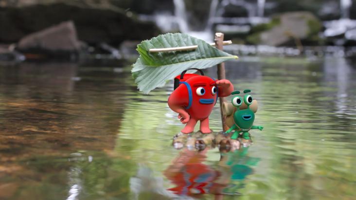 two animated characters standing in a puddle